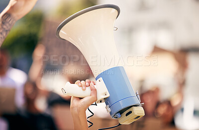 Buy stock photo Hand, megaphone closeup and outdoor protest for change, justice or environment for people together in city. Bullhorn, loudspeaker and zoom for communication, speech or leadership for politics on road