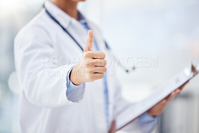 Buy stock photo Closeup shot of an unrecognisable doctor showing thumbs up in a hospital