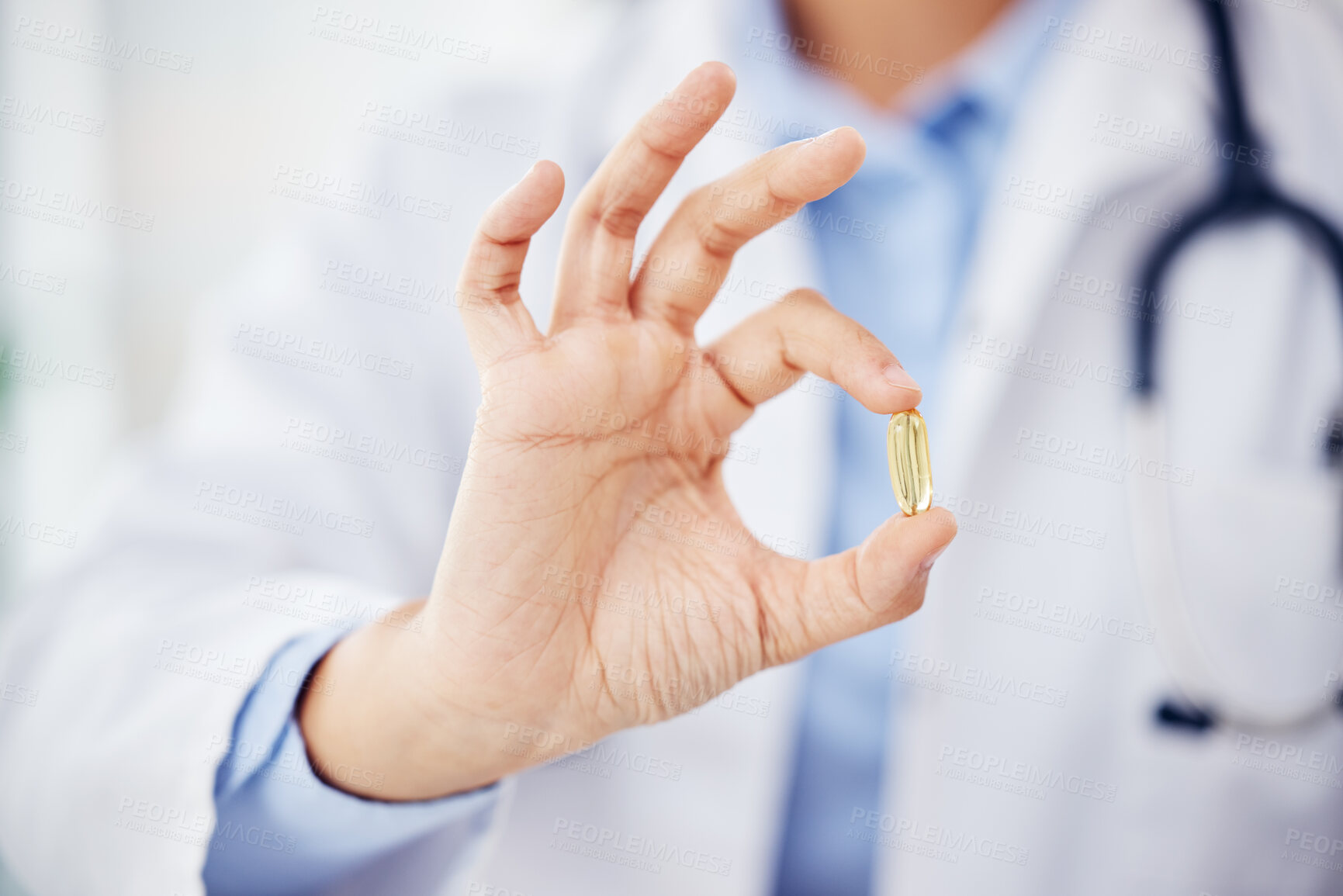 Buy stock photo Closeup shot of an unrecognisable doctor holding a pill in a hospital
