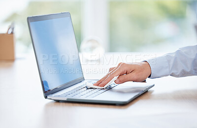 Buy stock photo Shot of an unrecognizable businessperson cleaning a laptop at work