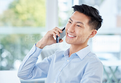 Buy stock photo Shot of a young businessman on a call at work