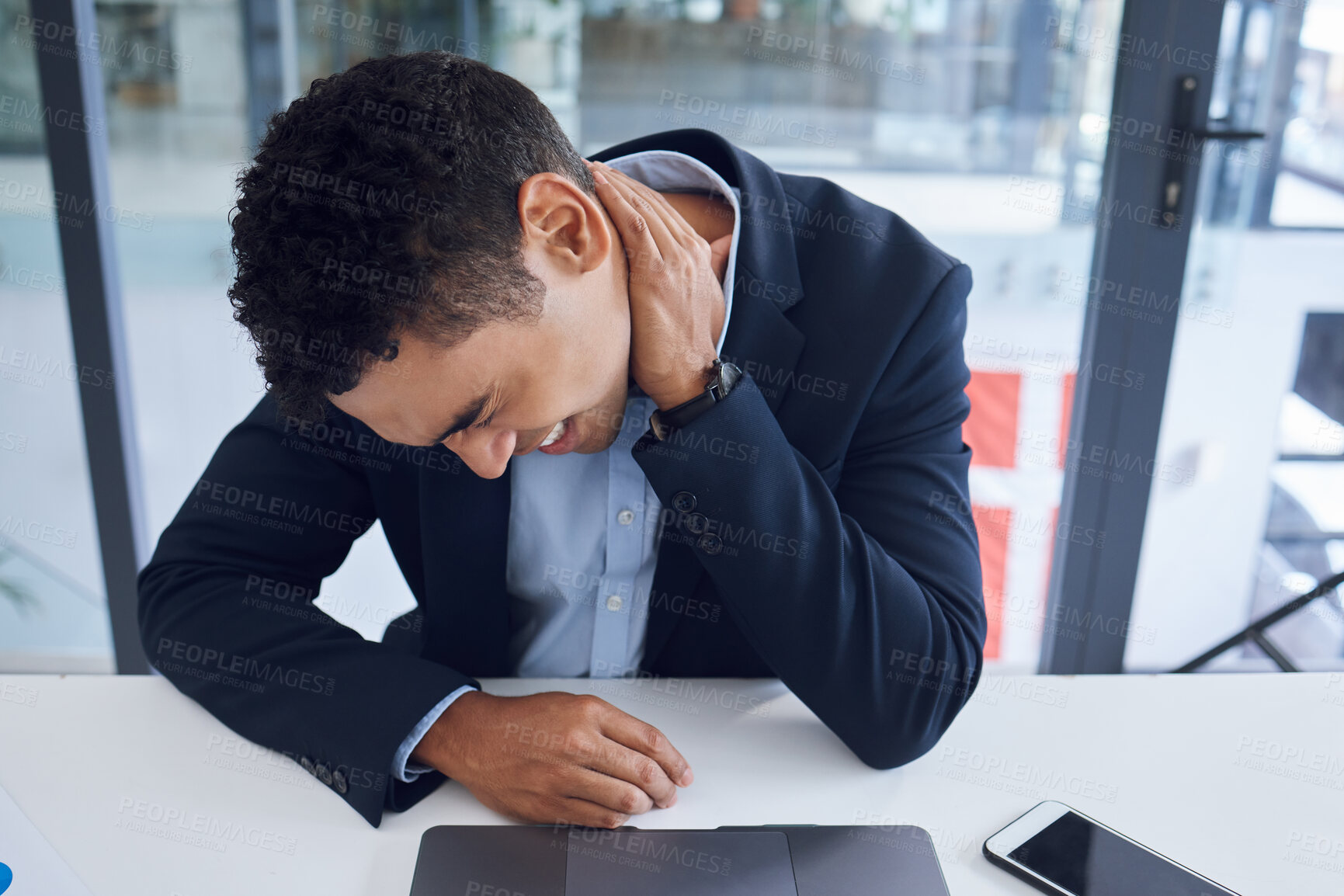 Buy stock photo Business, neck pain and man at desk, burnout and overworked with muscle tension in modern office. Person, employee or consultant with stress, tired and fatigue with health risk, body injury or crisis