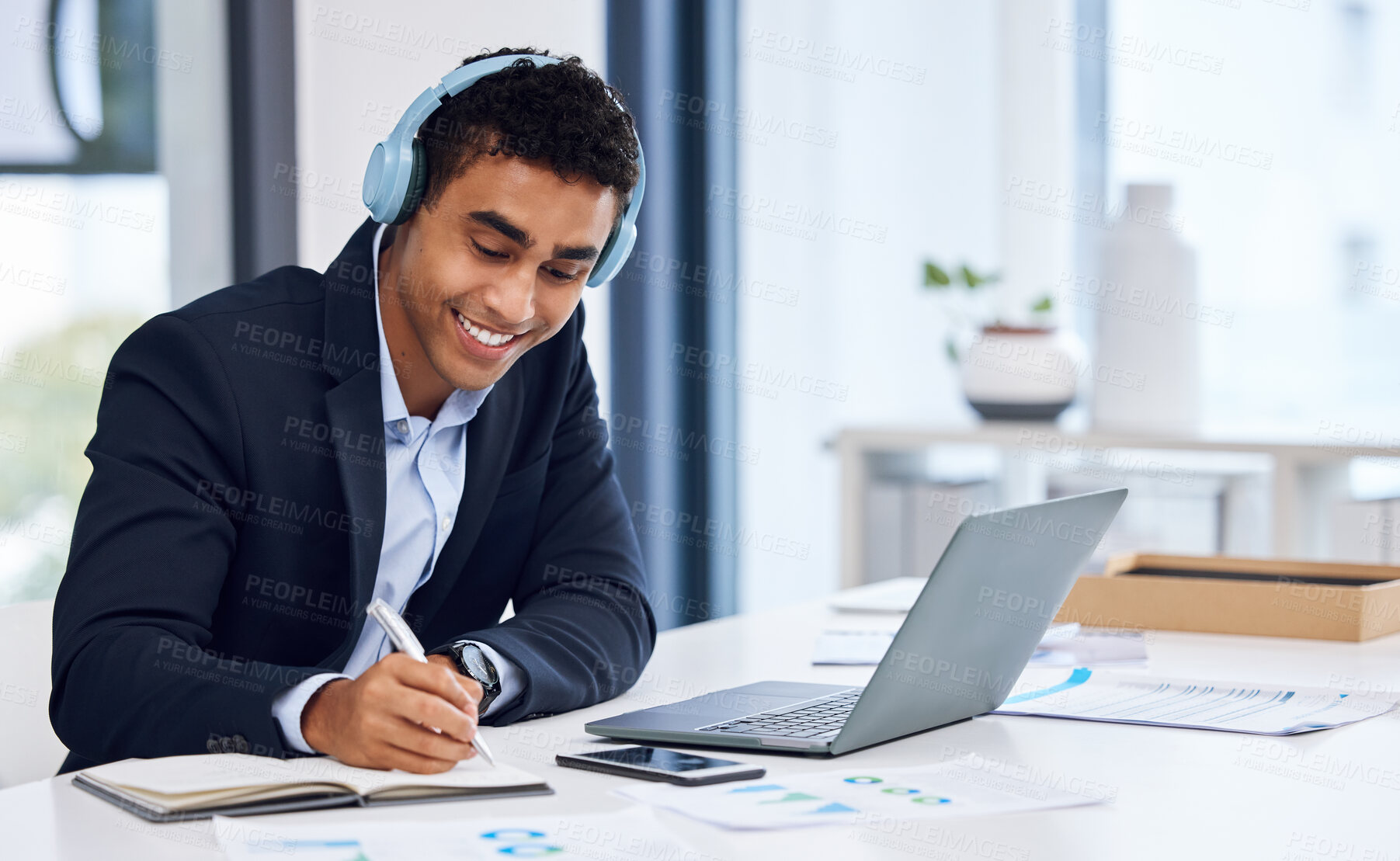 Buy stock photo Notebook, laptop and businessman with headphones writing notes for company budget planning. Computer, research and male financial advisor listening to money investment podcast for advice in workplace