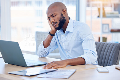 Buy stock photo Shot of a young businessman sleeping at his desk at work