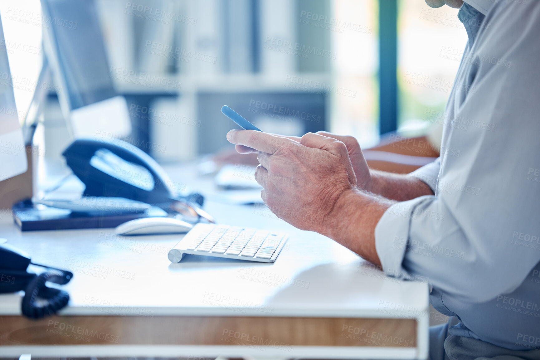 Buy stock photo Office, computer and hands of businessman with phone for communication, contact or b2b networking. Professional, corporate and person on smartphone for internet, website and social media on break