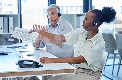 Buy stock photo Woman, call center and angry in office with stress, frustrated or throw keyboard by colleague man. Person, consultant and voip for tech support with chaos, crisis or annoyed at telemarketing agency