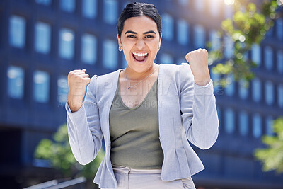 Buy stock photo Portrait of a young businesswoman cheering in the city