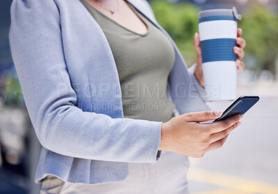 Buy stock photo Closeup shot of an unrecognisable businesswoman using a cellphone while drinking from a reusable cup in the city
