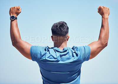 Buy stock photo Rearview shot of a man celebrating while out for a workout