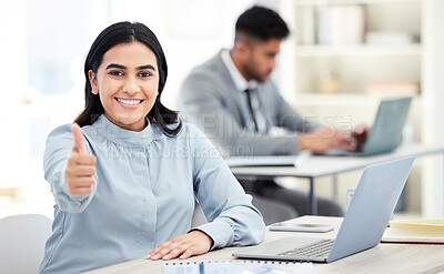 Buy stock photo Portrait of a young businesswoman showing thumbs up while working in an office