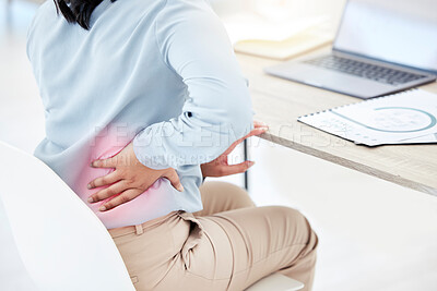 Buy stock photo Closeup shot of an unrecognisable businesswoman experiencing lower back pain while working in an office