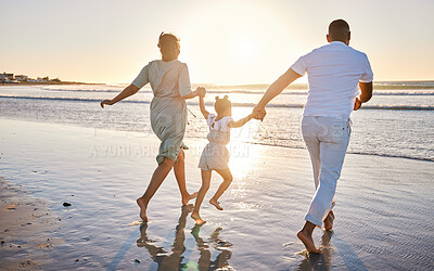 Buy stock photo Beach, parents and child with holding hands for running, playful and bonding together on vacation holiday. Family, mother and father with girl for security, connection and air game in ocean by back