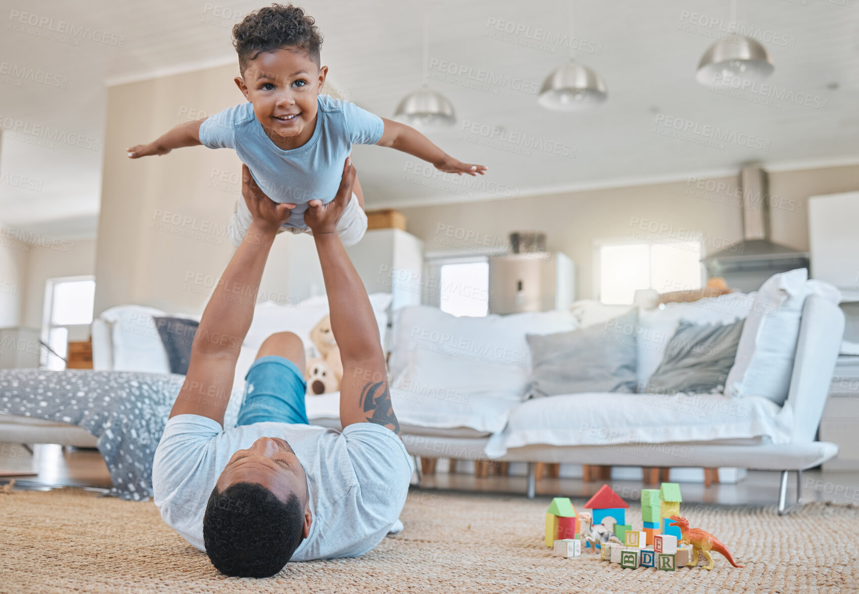 Buy stock photo Family, dad and home with young child and game with flying, floor and development of toddler in living room. Toys, happy and fun with playing, bonding and support together with care in the morning