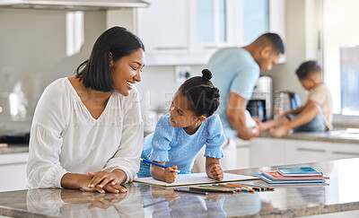 Buy stock photo Shot of a young mother helping her daughter with homework at home