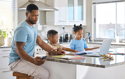 Buy stock photo Shot of a young father using a phone while helping his children with homework at home