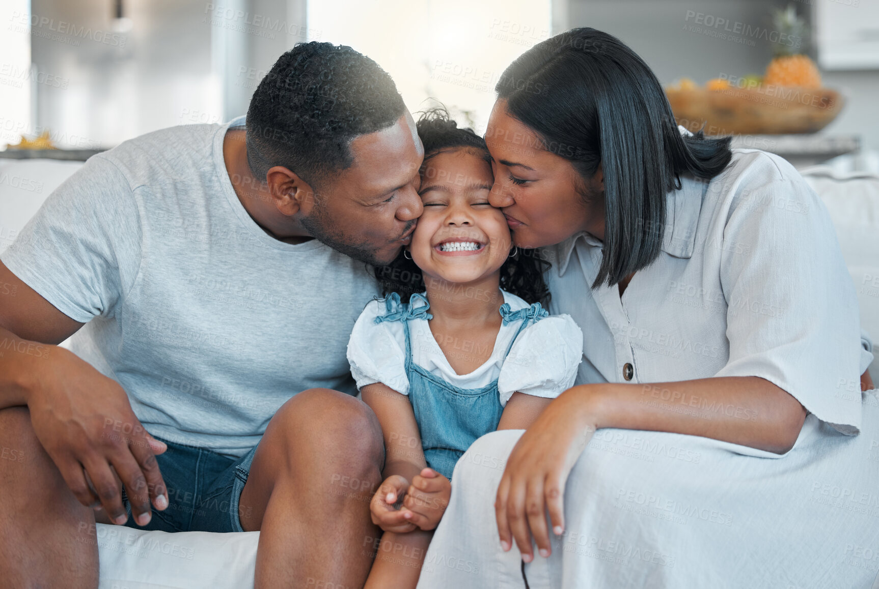 Buy stock photo Parents, kid and smile with kiss on sofa with bonding, connection and affection with support in home. Happy family, people and girl on couch with embrace, love and relationship for security and care