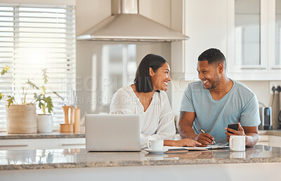 Buy stock photo Couple, kitchen and documents for budget, finance and smile with laptop, phone and writing notes in home. Man, woman and paperwork for savings, happy and computer for tax, compliance and investing