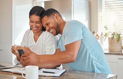 Buy stock photo Couple, happy and phone in kitchen for planning, funny media and excited for travel approval. Man, woman and tech in home for holiday budget, finance and laugh with mobile for comedy story or update