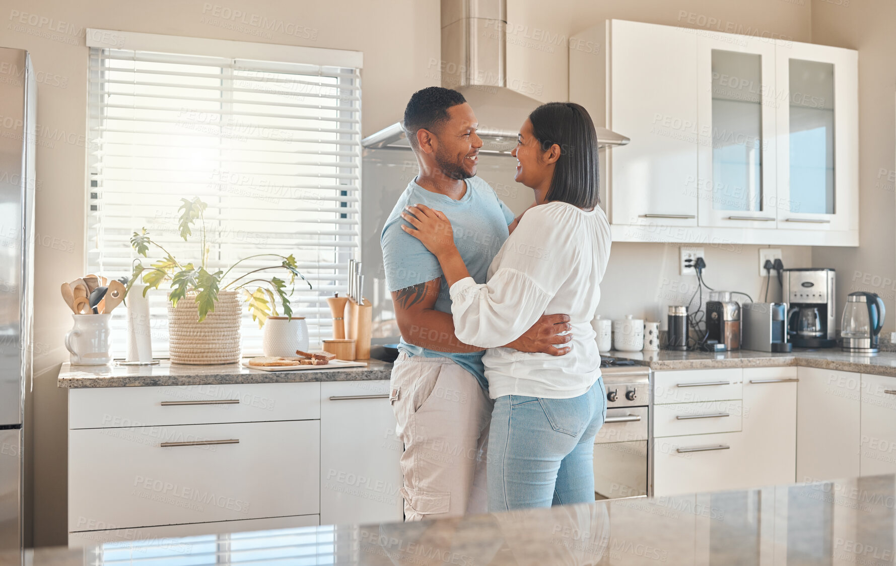 Buy stock photo Love, smile and couple dance in home for romantic relationship, support and bonding together. Music, man and woman moving in kitchen to celebrate anniversary, connection and commitment with partner