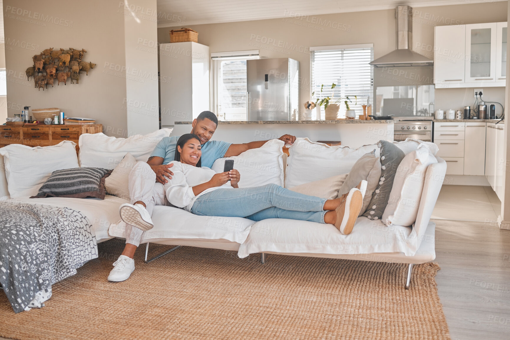 Buy stock photo Couple, couch and smile with smartphone in living room on internet, entertainment and social media. People, relationship and happy or laughing with funny videos, memes or website subscription at home