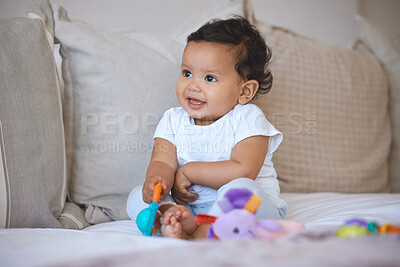 Buy stock photo Baby, kid and playing with toy on bed in home for creative imagination, sensory development and activity. Curious, girl and plastic rattle in bedroom for motor skills, learning or happy interaction