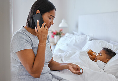 Buy stock photo Shot of a woman taking her little boys temperature with a thermometer in bed at home