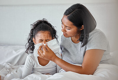 Buy stock photo Shot of a mother helping her sick daughter at home
