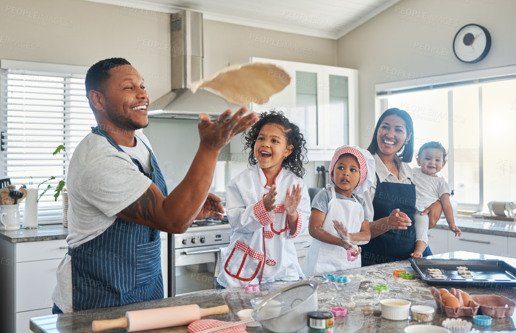 Buy stock photo Family, playing and baking in home with dough, family bonding and together for food prep. Parents, kids and love for learning to cook in kitchen, helping children and throw pastry or dessert in air