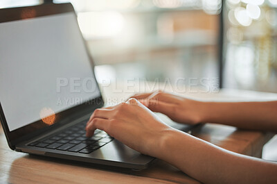 Buy stock photo Shot of a businesswoman working on her laptop at a cafe