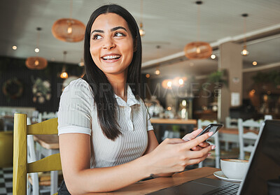 Buy stock photo Shot of a young businesswoman enjoying a cup of coffee in a cafe