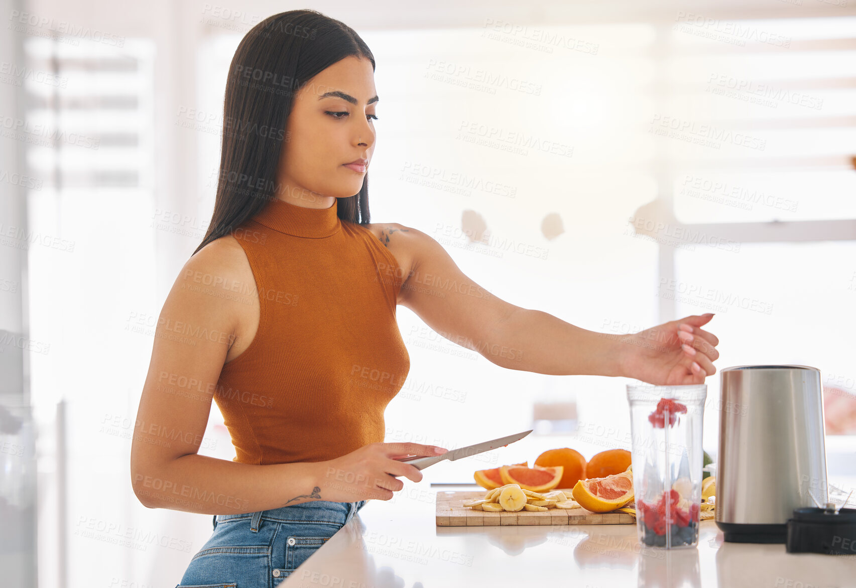 Buy stock photo Fruit, smoothie and blender with woman in kitchen for gut health, diet and breakfast. Wellness, detox and nutrition with female person at home for cooking, juice and weight loss milkshake