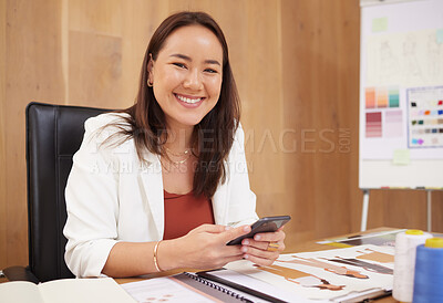 Buy stock photo Shot of a young businesswoman using a phone at work