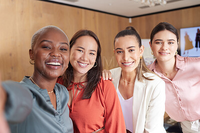 Buy stock photo Shot of a group of young businesswoman taking a selfie at work