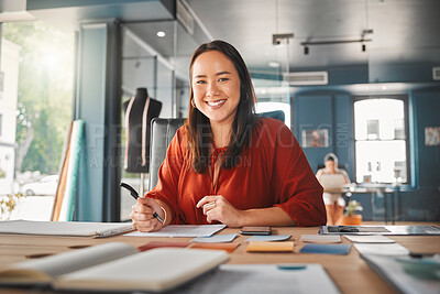 Buy stock photo Shot of a young businesswoman working in an office