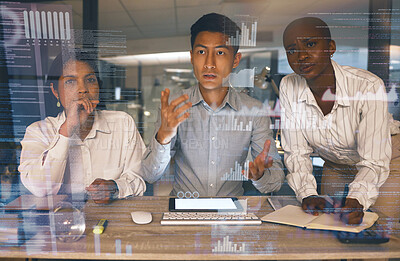 Buy stock photo Shot of a group of businesspeople working late in a modern office