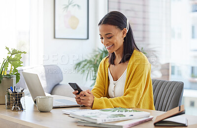 Buy stock photo Shot of a young businesswoman using a phone in a modern office at work