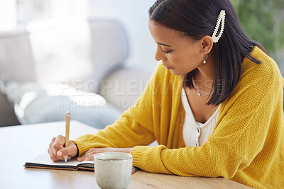 Buy stock photo Shot of a young businesswoman working in a modern office at work