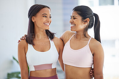 Buy stock photo Shot of two sporty young women in a yoga studio