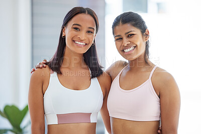 Buy stock photo Portrait of two sporty young women in a yoga studio
