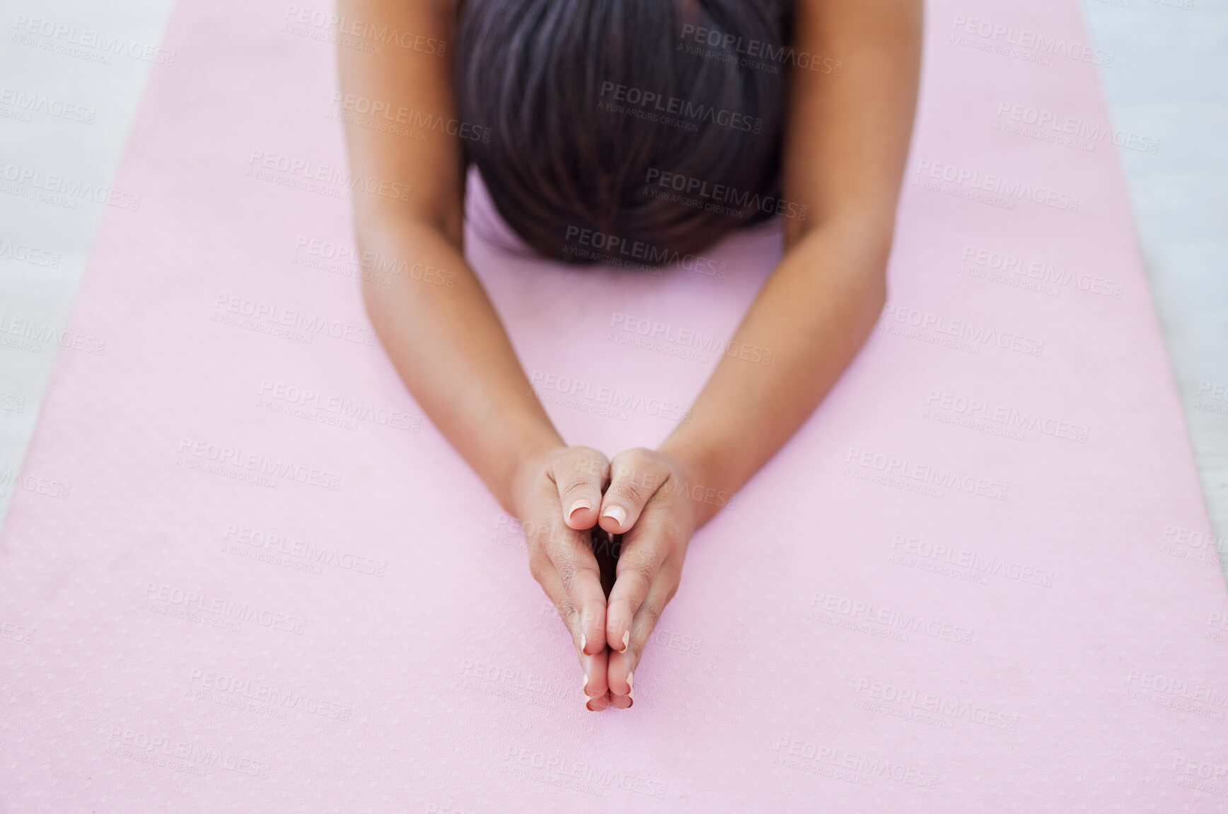 Buy stock photo Closeup shot of an unrecognisable woman doing child's pose while exercising in a yoga studio