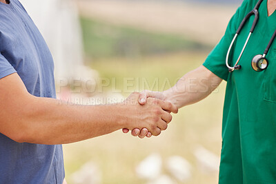 Buy stock photo Closeup shot of an unrecognisable man shaking hands with a veterinarian on a poultry farm