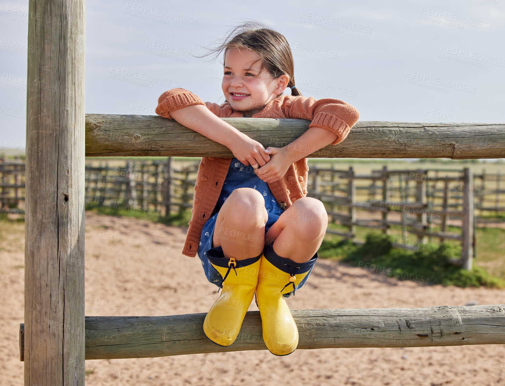 Buy stock photo Shot of an adorable little girl playing outside on the farm