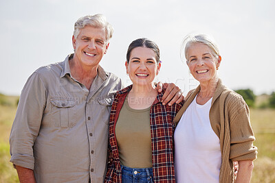 Buy stock photo Shot of a young woman on a farm with her senior parents