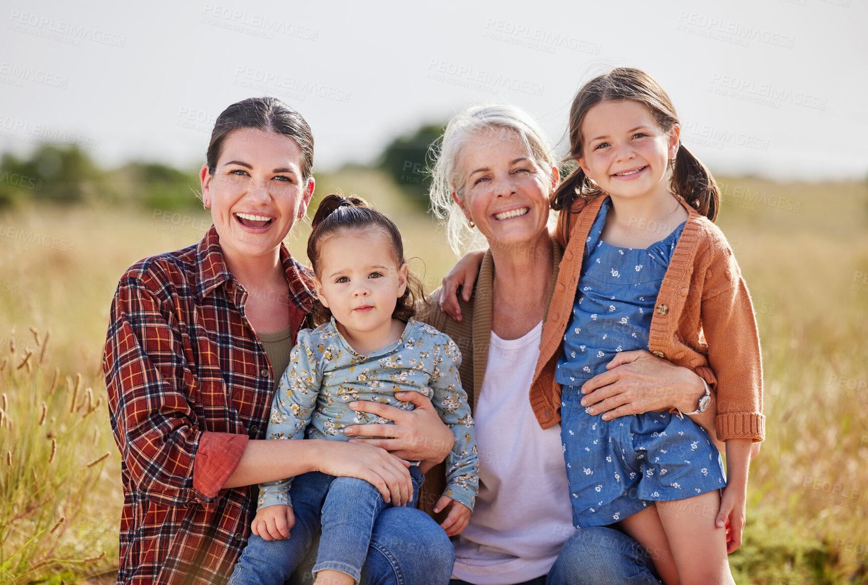 Buy stock photo Shot of two little girls on a farm with their mother and grandmother