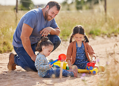 Buy stock photo Shot of two little girls playing together on a farm with their father
