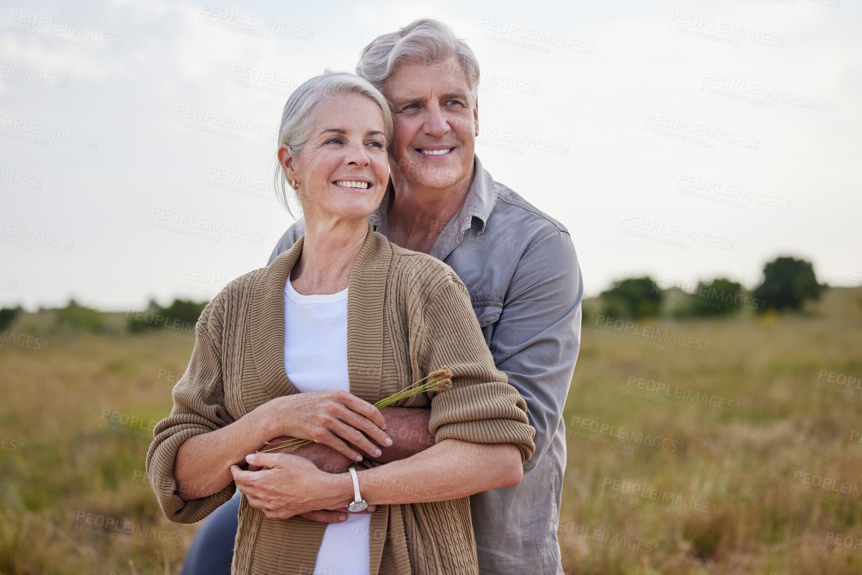 Buy stock photo Love, hug and happy with old couple in nature for bonding, smile and romance. Happiness, retirement and support with senior man and woman in countryside for affectionate, holiday and vacation