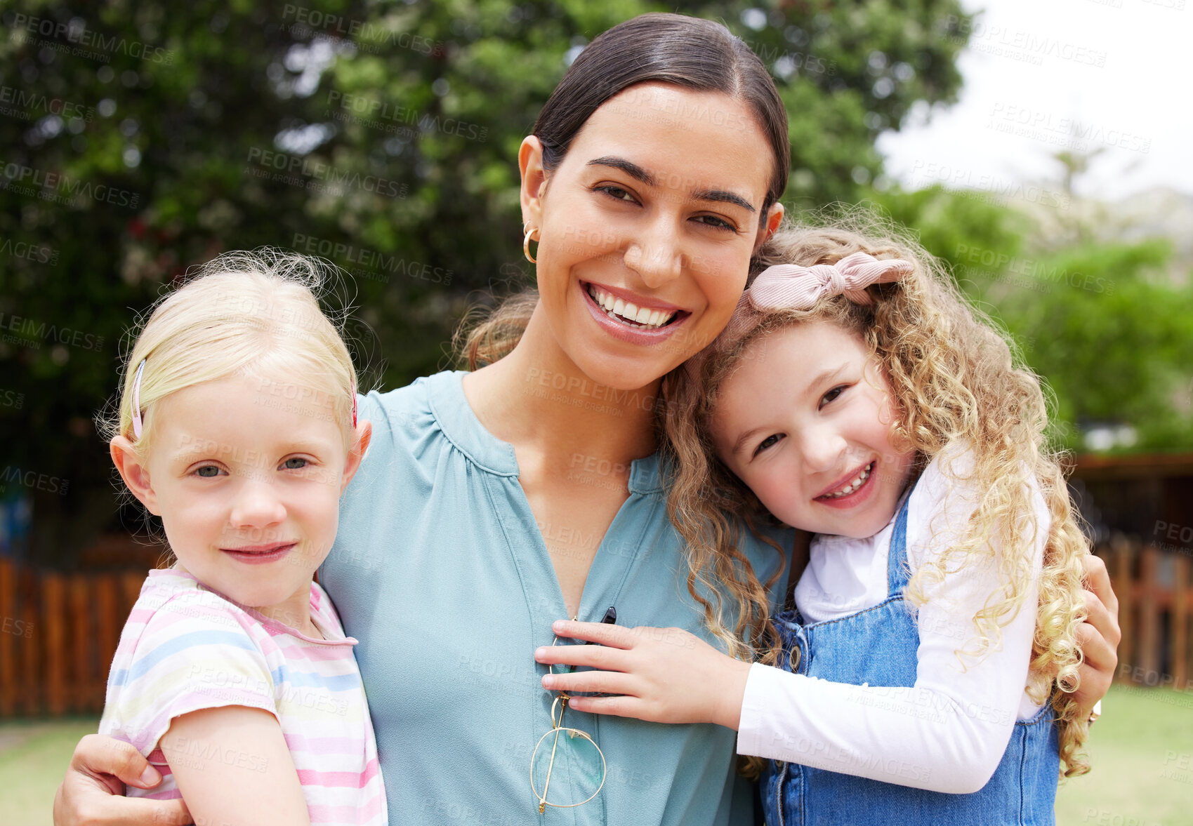 Buy stock photo Shot of a teacher spending time outside with preschool children