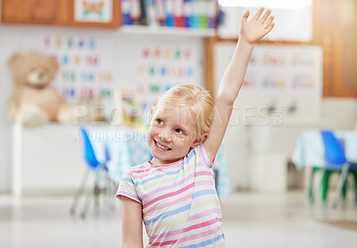 Buy stock photo Shot of a little girl raising her hand in class