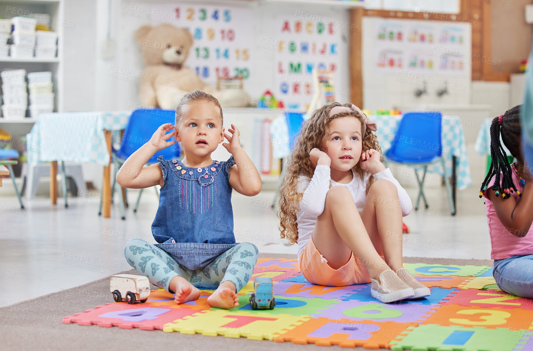 Buy stock photo Shot of two little girls sitting next to each other in class