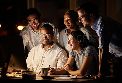 Buy stock photo Shot of a group of businesspeople working together on a computer in an office at night